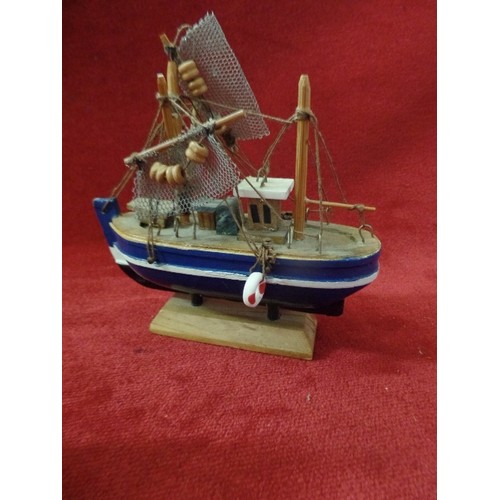 107 - 4 X SMALL WOODEN FISHING BOATS.