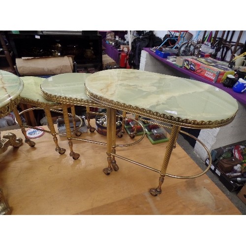 544 - RETRO ONYX AND GOLD GILT NEST OF 3 TABLES. ON CASTORS.