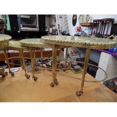 544 - RETRO ONYX AND GOLD GILT NEST OF 3 TABLES. ON CASTORS.