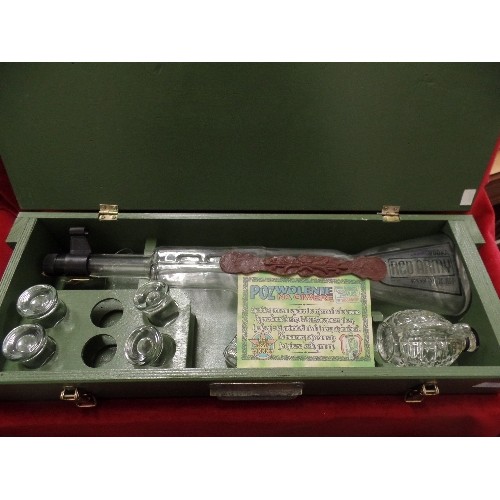 110 - RED ARMY VODKA GAME. IN LARGE ARMY-STYLE WOODEN BOX. CONTAINS LARGE REVOLVER SHAPED DECANTER, SHOT G... 