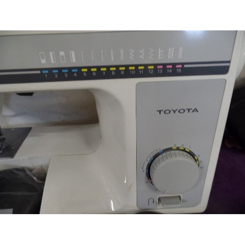 229 - TOYOTA SEWING MACHINE, WITH ZIG-ZAG & FANCY STITCH FUNCTION. WITH DUST BAG.