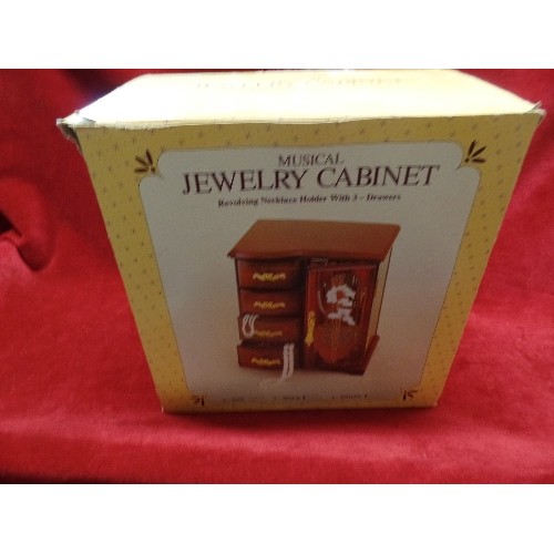 274 - MUSICAL JEWELLERY CABINET. IN ORIGINAL BOX.