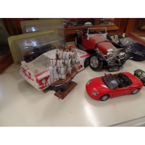 620 - 2 BOXED MOTORCYCLES, 4 DIE-CAST VEHICLES, PAPERWEIGHT, AND A WOODEN MODEL BOAT.