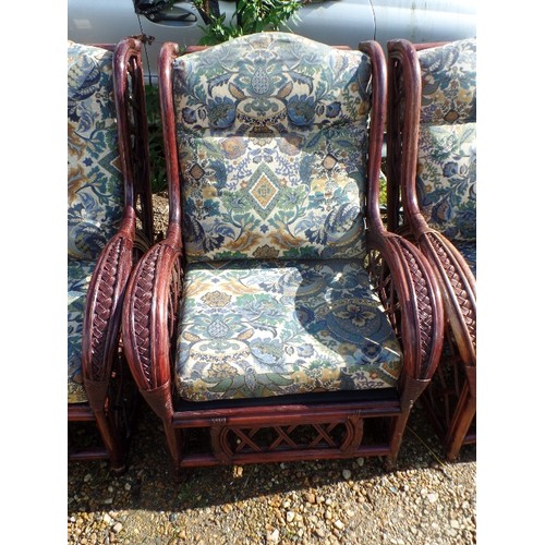 415 - 4 X LARGE DARK CANE GARDEN ARMCHAIRS. DEEP UPHOLSTERED SQUARE CUSHION PADS IN ATTRACTIVE PATTERNED F... 