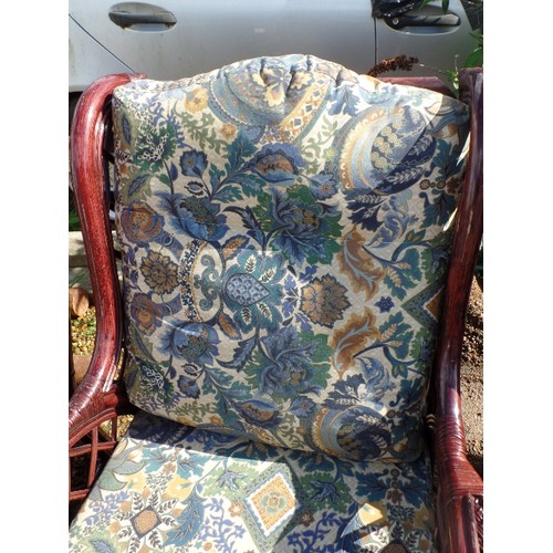 415 - 4 X LARGE DARK CANE GARDEN ARMCHAIRS. DEEP UPHOLSTERED SQUARE CUSHION PADS IN ATTRACTIVE PATTERNED F... 