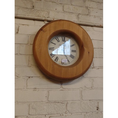 209 - PINE-FRAMED WALL CLOCK WITH ROMAN NUMERALS.