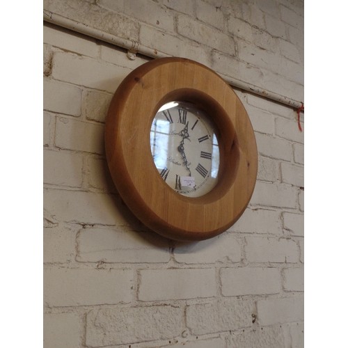 209 - PINE-FRAMED WALL CLOCK WITH ROMAN NUMERALS.