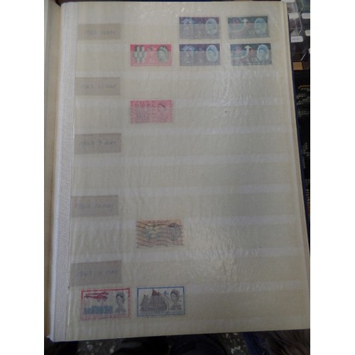 252 - 4 X LARGE STAMP STOCK BOOKS. CONTAINING LARGE QUANTITY OF STAMPS.