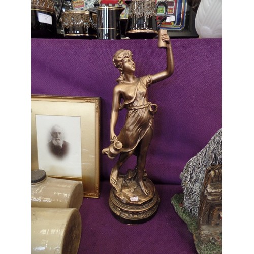 127 - LARGE WATER CARRIER FIGURE IN ANTIQUED BRASS EFFECT.