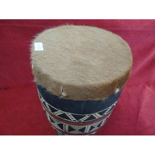 104 - ETHNIC HAND DRUM. WOODEN AZTEC PATTERNED BARREL WITH HIDE TOP. BOTTOM HAS BEEN REPAIRED.