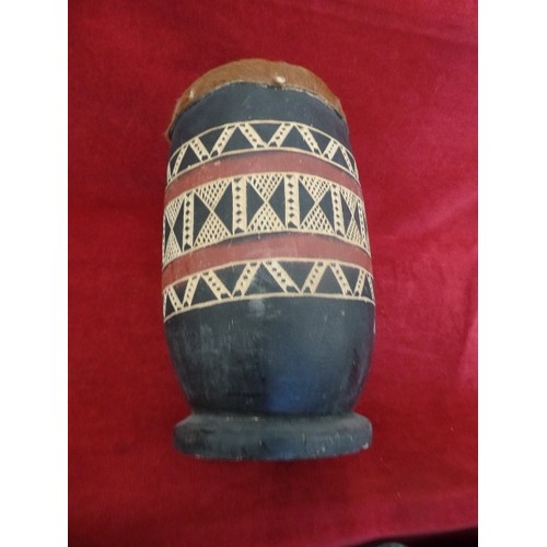 104 - ETHNIC HAND DRUM. WOODEN AZTEC PATTERNED BARREL WITH HIDE TOP. BOTTOM HAS BEEN REPAIRED.