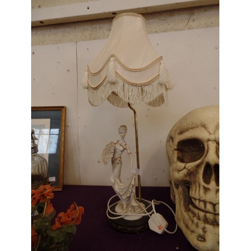 114 - TABLE LAMP, WITH ELEGANT LADY FIGURE AT BASE. IVORY SHADE, FRINGED.