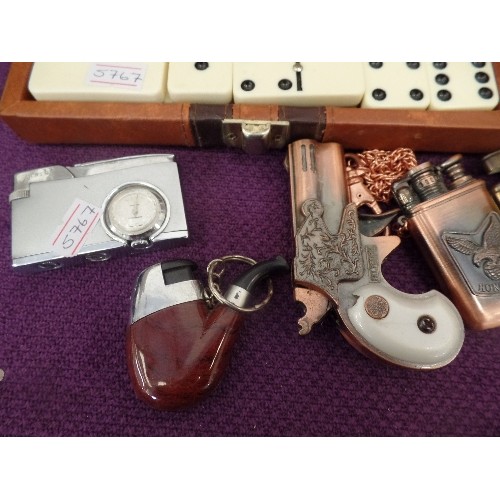 100 - COLLECTION OF NOVELTY LIGHTERS. INC A JANINE CAMERA LIGHTER, A BRASS MUSICAL LIGHTER, A PIPE, A REVO... 