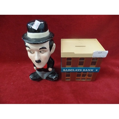 127 - 2 X VINTAGE MONEY BOXES. BARCLAYS BANK, AND CHARLIE CHAPLIN.