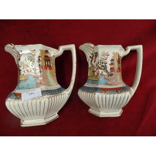 244 - A PAIR OF VINTAGE JUGS. ORIENTAL DECORATION.