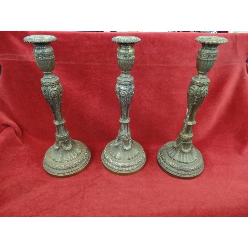 264 - 3 X HEAVY BRASS ORNATE CANDLESTICKS.