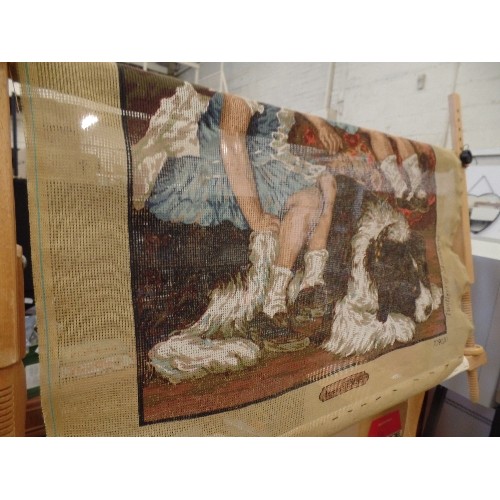 295 - WOODEN TAPESTRY WORKING FRAME. ADJUSTABLE. TOGETHER WITH A CANVAS OF RENOIR IMAGE OF 2 GIRL (STARTED... 