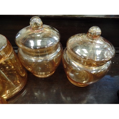 382 - CARNIVAL WARE. AMBER. 3 X LIDDED CANNISTERS, BON-BON DISH AND A BOWL.