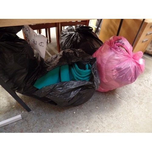 561 - 4 X LARGE BAGS OF CLOTHING, COATS AND TEXTILES. APPEAR TO BE GOOD CLEAN CONDITION.