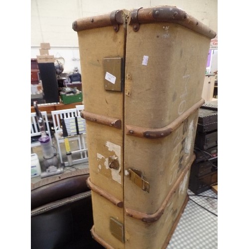 564 - LARGE VINTAGE CANVAS TRUNK, WITH WOODEN BANDING. IN A DULL MUSTARD COLOUR.