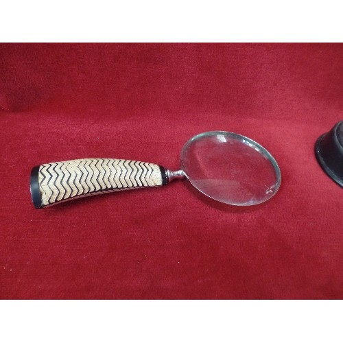 6 - AN ACROBATIC TOY - WORKS BY MAGNET & BATTERY, A WOODEN DOORSTOP AND A MAGNIFYING GLASS WITH ZIGZAG S... 