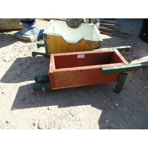 538 - 2 LITTLE HANDMADE CHILDREN'S WHEELBARROWS/ DECORATIVE PLANTERS. PAINTED WOOD