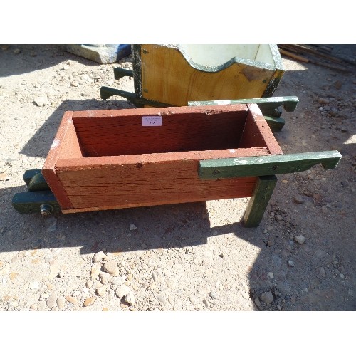 538 - 2 LITTLE HANDMADE CHILDREN'S WHEELBARROWS/ DECORATIVE PLANTERS. PAINTED WOOD