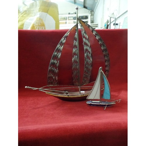 90 - DECORATIVE METAL SAIL BOAT. THE SAIL HAS TWISTED METAL DETAIL AND A RED PANEL. TOGETHER WITH A LOVEL... 