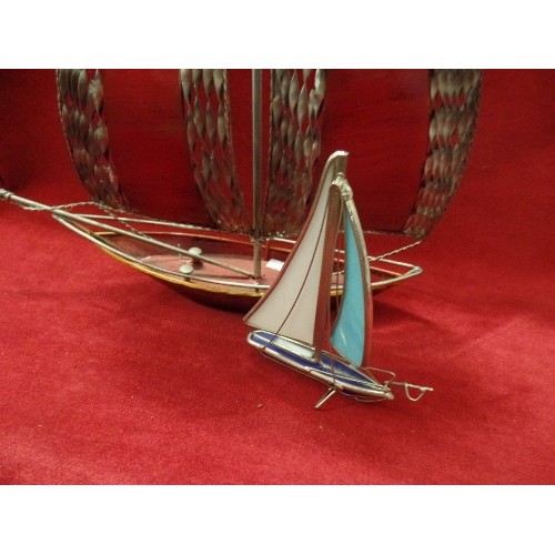 90 - DECORATIVE METAL SAIL BOAT. THE SAIL HAS TWISTED METAL DETAIL AND A RED PANEL. TOGETHER WITH A LOVEL... 