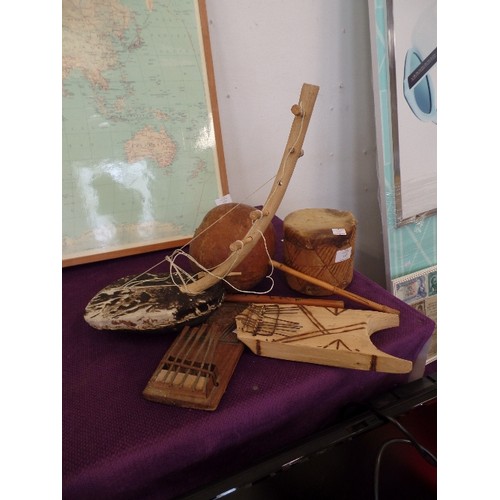 113 - COLLECTION OF AFRICAN NAIVE WOODEN MUSICAL INSTRUMENTS.