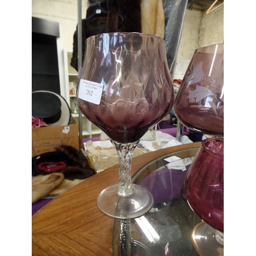 202 - COLLECTION OF 4 RETRO 'BRANDY GLASSES' IN AUBERGINE.