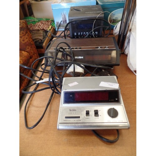 266 - 3 X VINTAGE DIGITAL ALARM CLOCK RADIOS. A SONY DIGICUBE, BUSH 6585, & AN ACCTIM VOICE STOP.