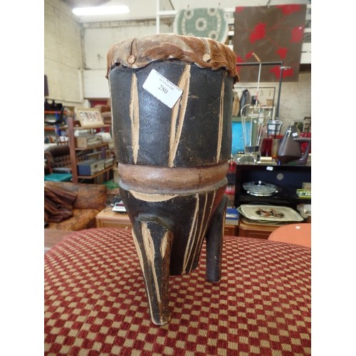 280 - TRIBAL HIDE TOPPED WOODEN DRUM.