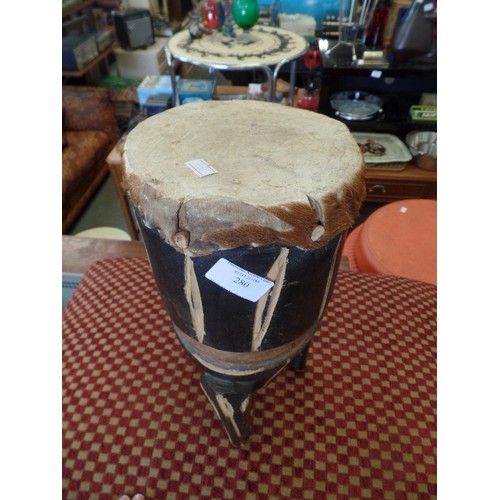 280 - TRIBAL HIDE TOPPED WOODEN DRUM.