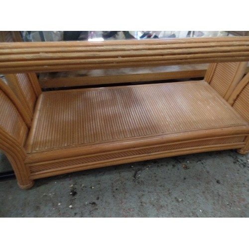 335 - CANE/BAMBOO CONSERVATORY COFFEE TABLE. GLASS TOPPED. LOWER SHELF.