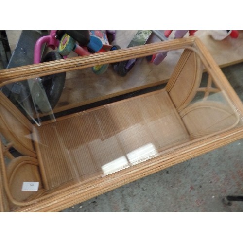 335 - CANE/BAMBOO CONSERVATORY COFFEE TABLE. GLASS TOPPED. LOWER SHELF.