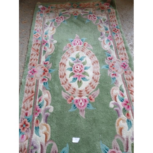 351 - SCULPTURED WOOL RUG IN LOVELY SOFT GREENS, PINKS CREAMS AND PURPLES. COTTON BACKED. RECTANGULAR. FRI... 