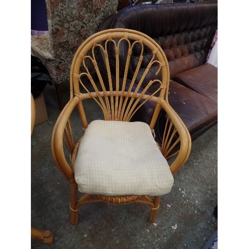 397 - CANE AND GLASS CONSERVATORY TABLE, APPROX 85CM DIAM, ALSO 1 CHAIR WITH DEEP GINGHAM SEAT PAD.