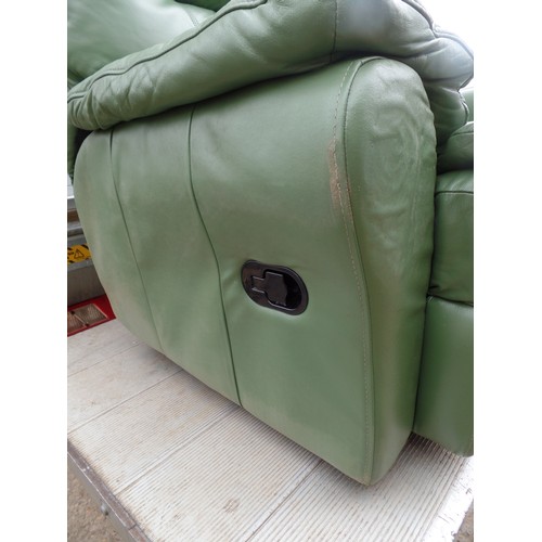 551 - GREEN FAUX LEATHER MANUAL RECLINING 2 SEATER SETTEE