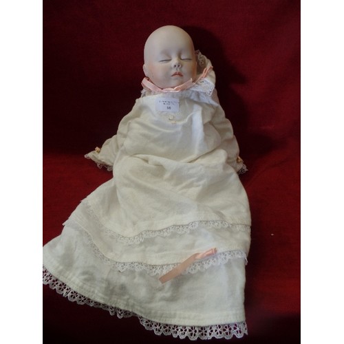 66 - ORIGINAL JOYCE WOLF 1928 FABRIC BODIED DOLL WITH BISQUE HEAD.  DRESSED IN VINTAGE BABY NIGHTDRESS.