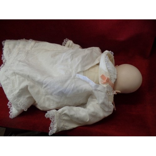 66 - ORIGINAL JOYCE WOLF 1928 FABRIC BODIED DOLL WITH BISQUE HEAD.  DRESSED IN VINTAGE BABY NIGHTDRESS.