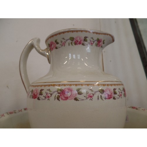 99 - WASH JUG AND BOWL SET, WHIE WIH PINK ROSE EDGING.  LARGE NIBBLE OUT OF THE BOWL