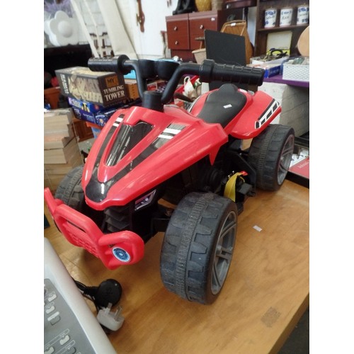 246 - CHILDS RED AND BLACK ELECTRIC POWERS QUAD BIKE