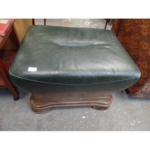 313 - FORREST GREEN LEATHER OTTOMAN/FOOTSTOOL ON CHUNKY WOODEN BASE.