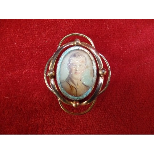 20 - A PINCHBECK DOUBLE PICTURE LOCKET WITH A PHOTOGRAPH OF A WW1 SOLDIER