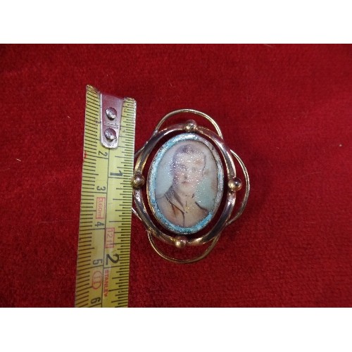 20 - A PINCHBECK DOUBLE PICTURE LOCKET WITH A PHOTOGRAPH OF A WW1 SOLDIER