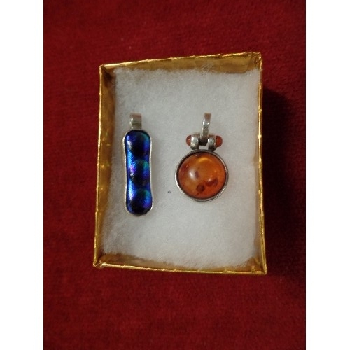 18 - 2 SILVER PENDANTS 1 AMBER THE OTHER BRIGHT BLUE STONE