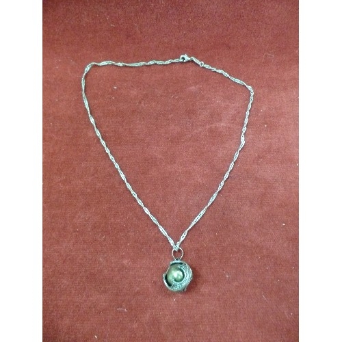 12 - A SILVER CHINESE VIBRATING BALL ON SILVER CHAIN