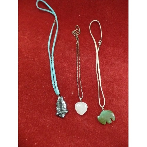 21 - THREE STONE NECKLACES INCLUDING CANADIAN JADE BUFFALO, ROSE QUARTZ HEART AND A GREY STONE BIRD ON A ... 