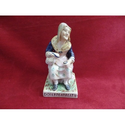 8 - A STAFFORDSHIRE EARTHENWARE FIGURE OF DOLLY PENTREATH ON A SQUARE BASE - MARKED 1753 TO BACK. SAID T... 